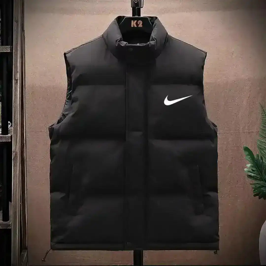 Men's black puffer vest with thick padding for cold weather
