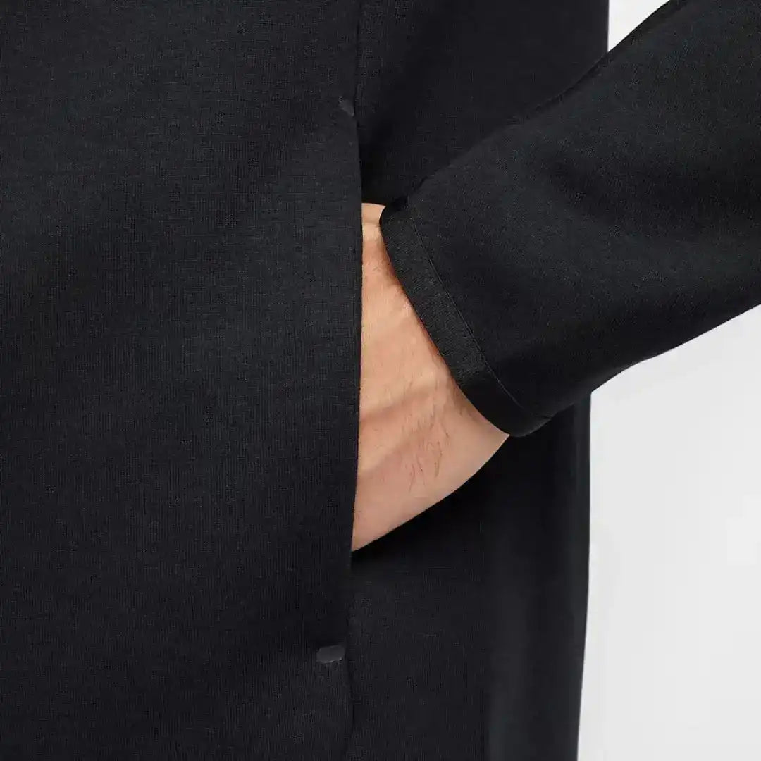 Close-up of a black jogger waistband and side pocket.