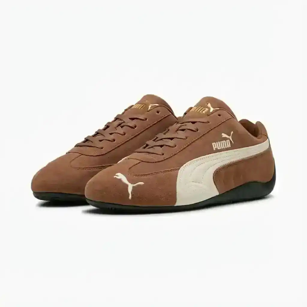 Brown and beige Puma sneakers on a white background