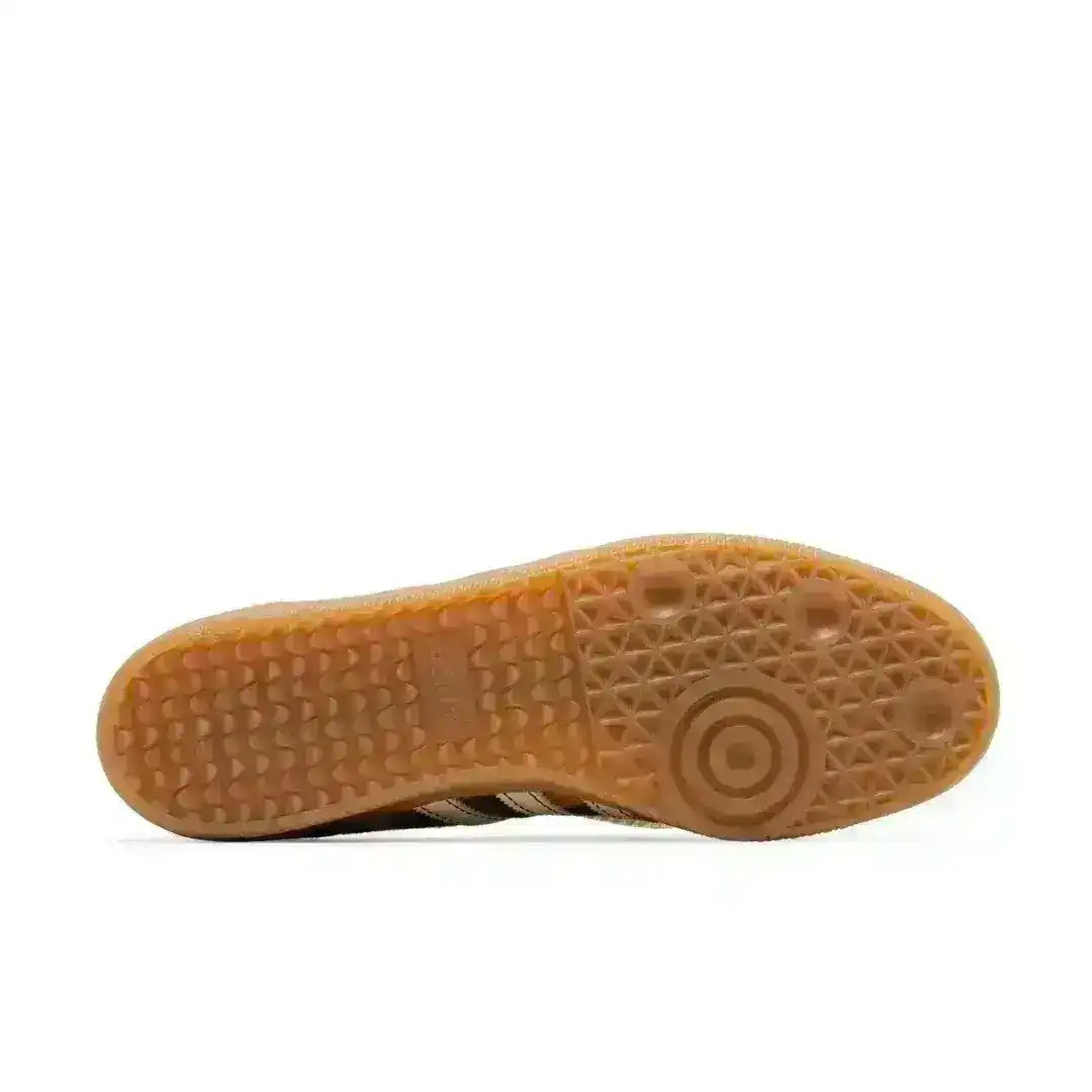 Side view of the Adidas Samba Leopard sneaker, highlighting the clean leather upper, textured toe overlay, and distinctive patterned detailing on the stripes.
